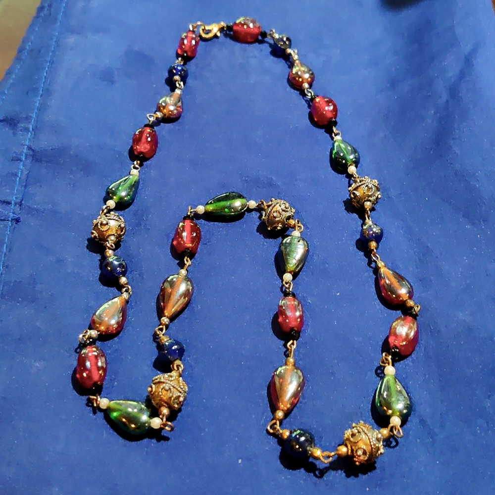 Glass beaded 56" long blue and clear necklace